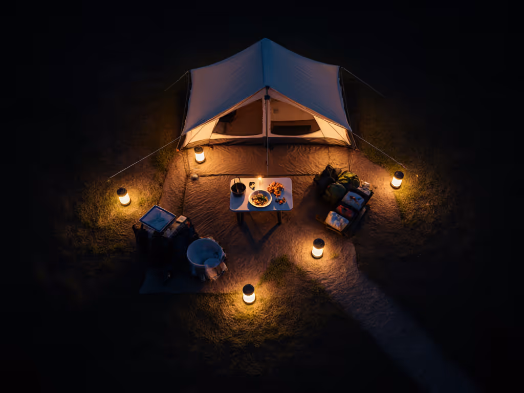 overhead_view_of_campsite_lighting_setup_showing_layered_lanterns_and_strategic_positioning